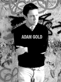 photo of Adam Gold against graffiti board