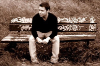 photo of Adam Gold sitting on a bench